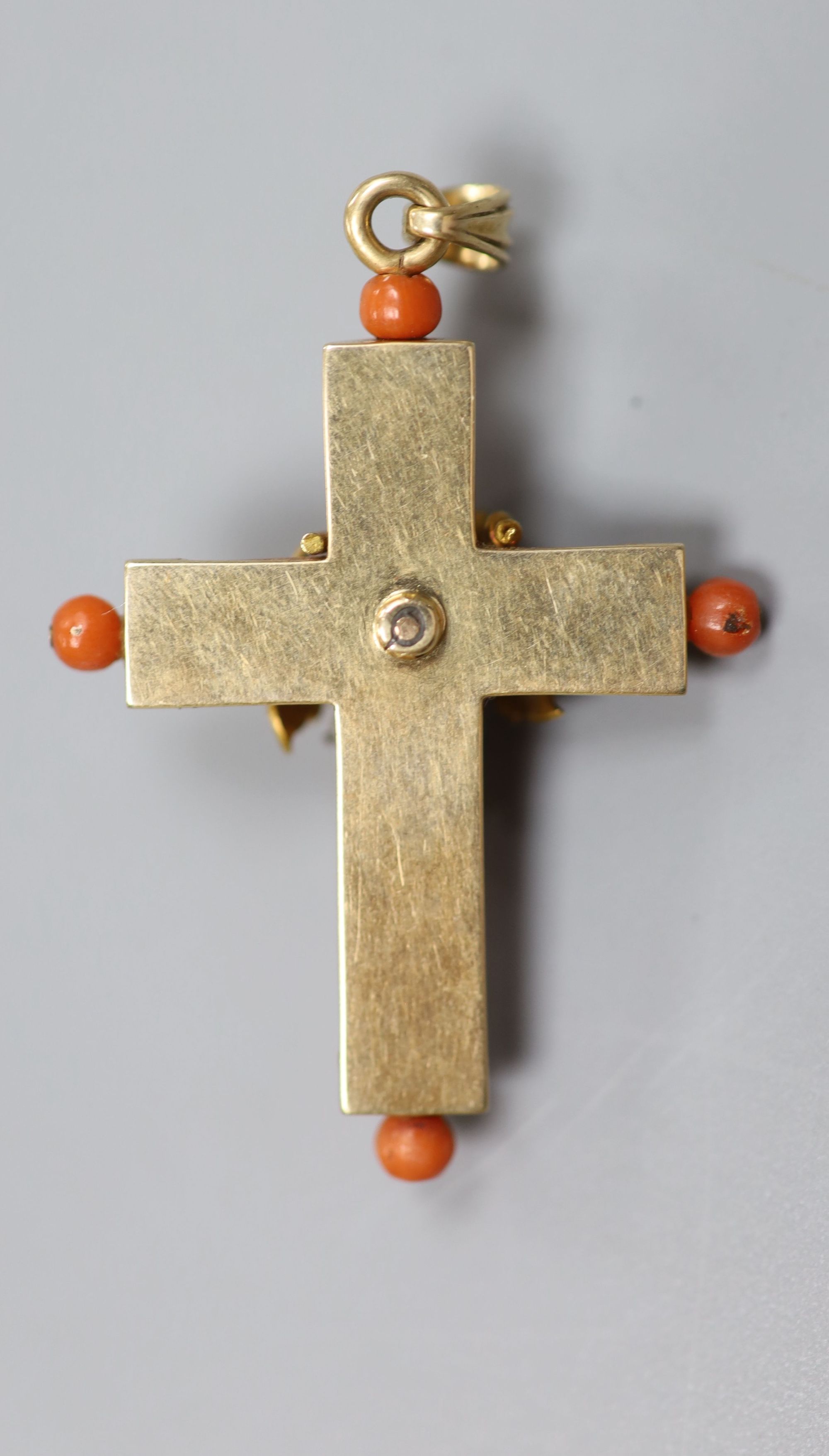 A 19th century yellow metal and seed pearl mounted coral cross pendant, 38mm, gross 5.7 grams.